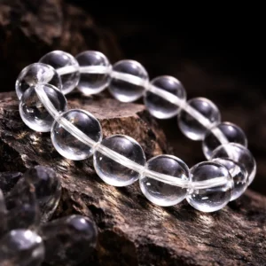 Clear Quartz bracelet on dark mystical background, representing Metal element, mental clarity, and energy amplification in Five Elements philosophy